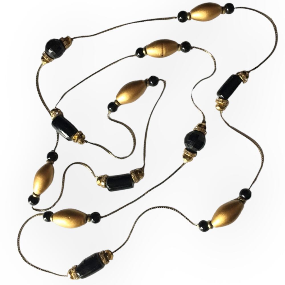 Flapper-length black and gold tone large bead accent necklace earring set